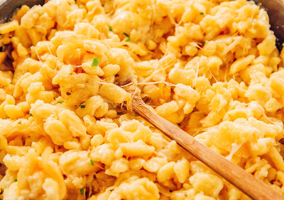 An up close look detailing the texture and creaminess of Kaesespaetzle 