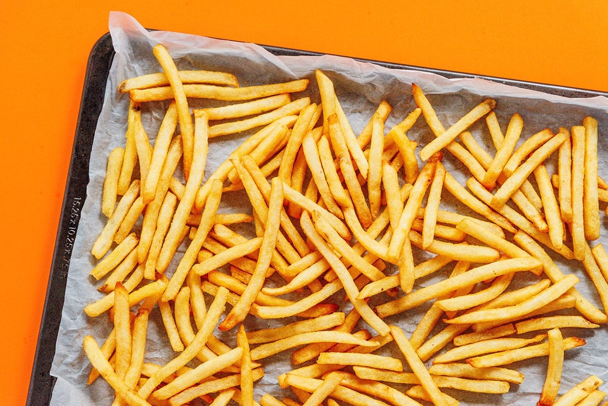A baking sheet filled with freshly air fryer French fries