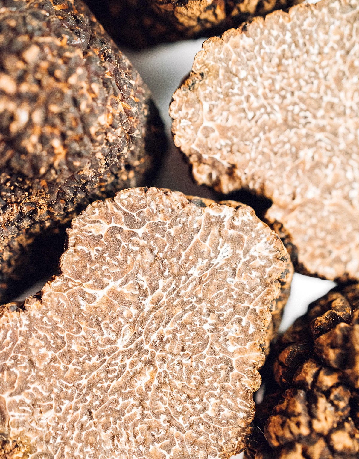 An up close view detailing the textures and colors of the inside of a truffle