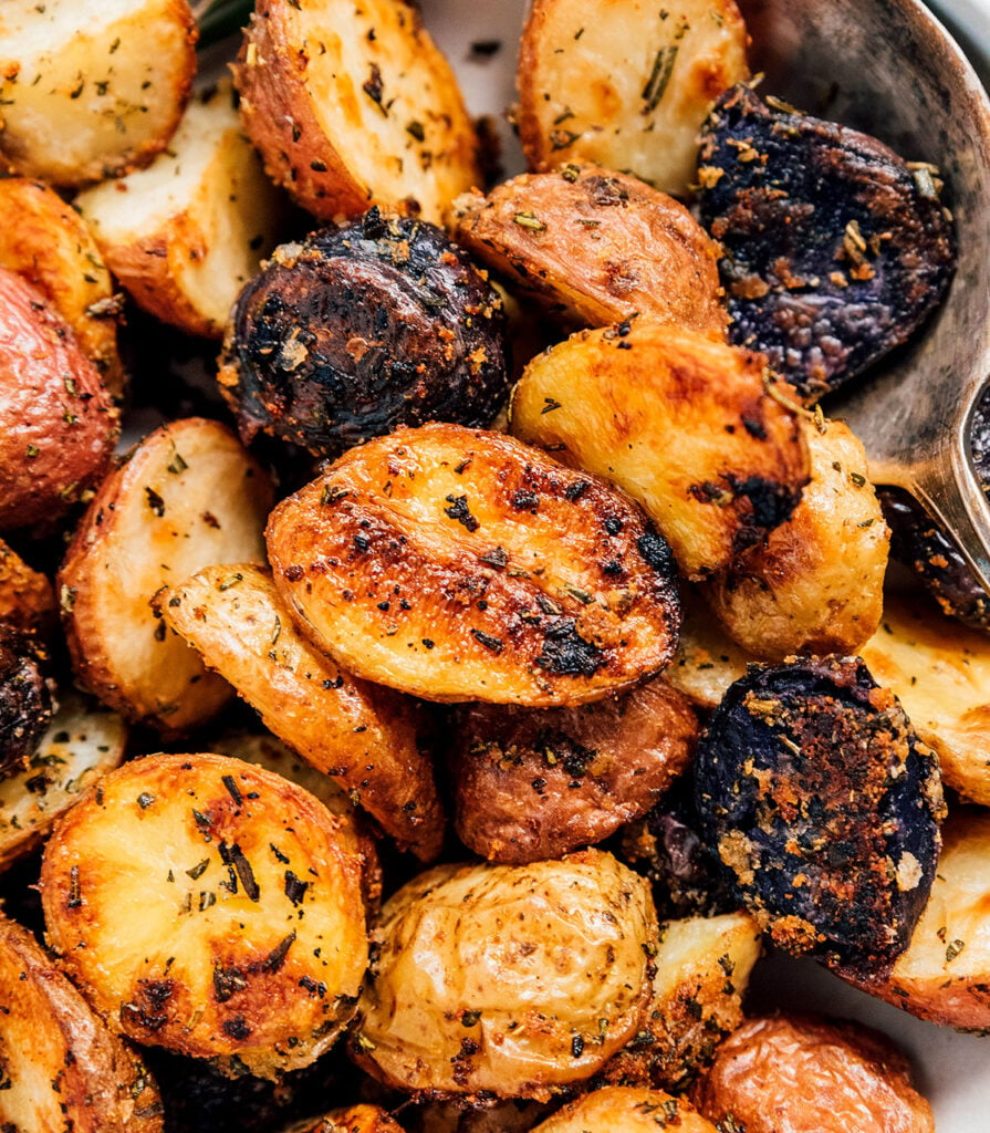 An up-close view detailing the colors and textures of rosemary roasted potatoes