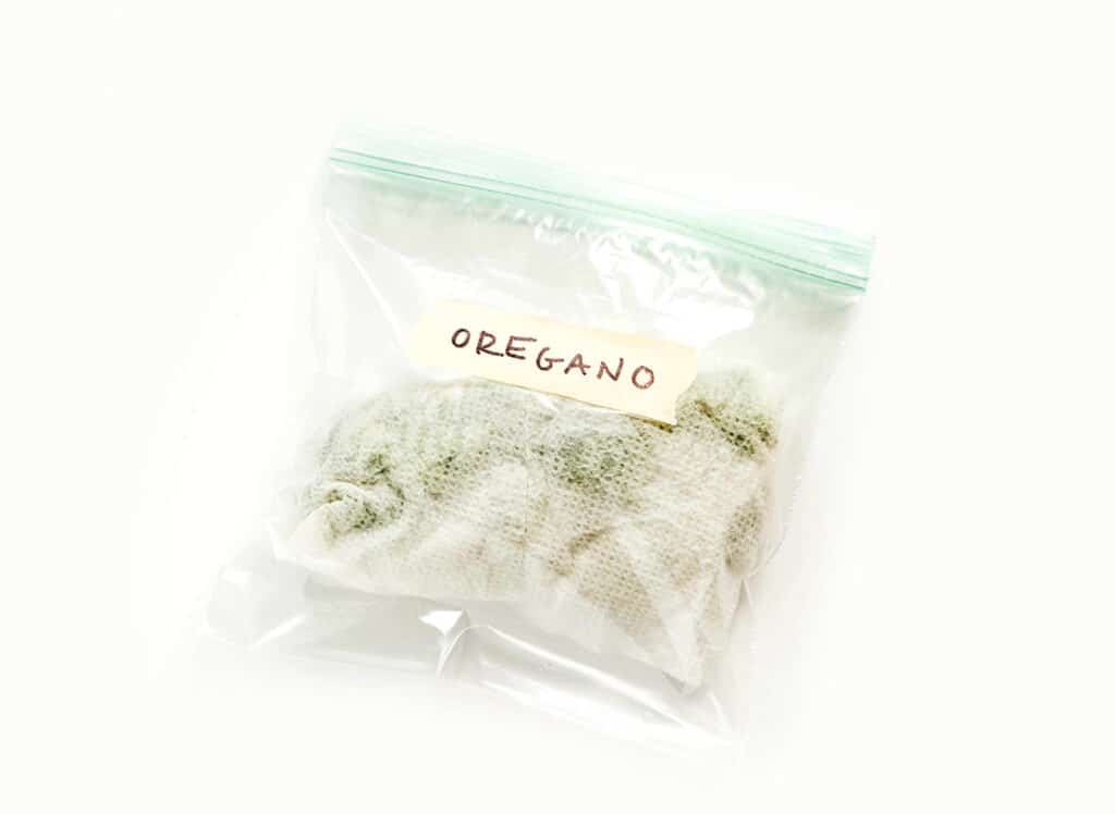 Oregano wrapped in a damp paper towel and placed in a sandwich baggie