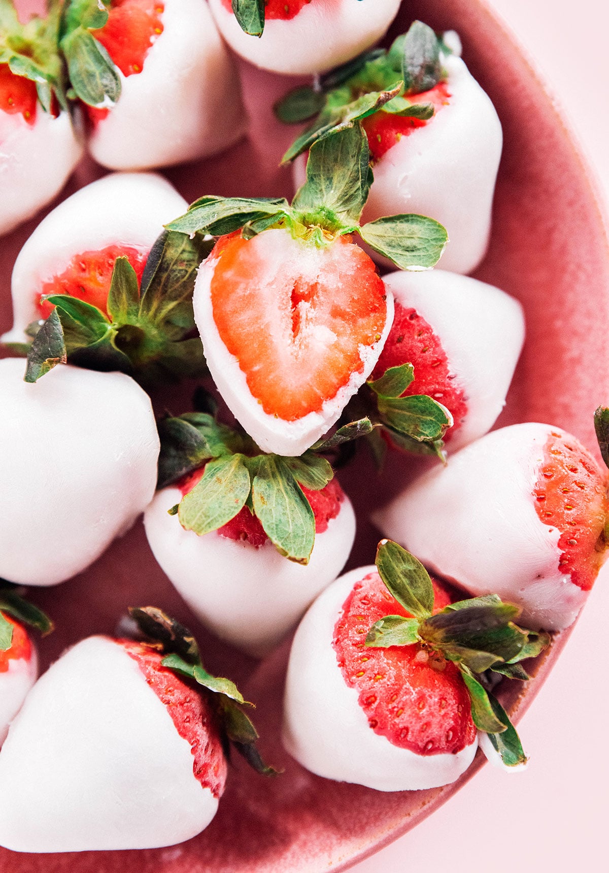 Whole strawberries that have been dipped in plain yogurt and frozen.