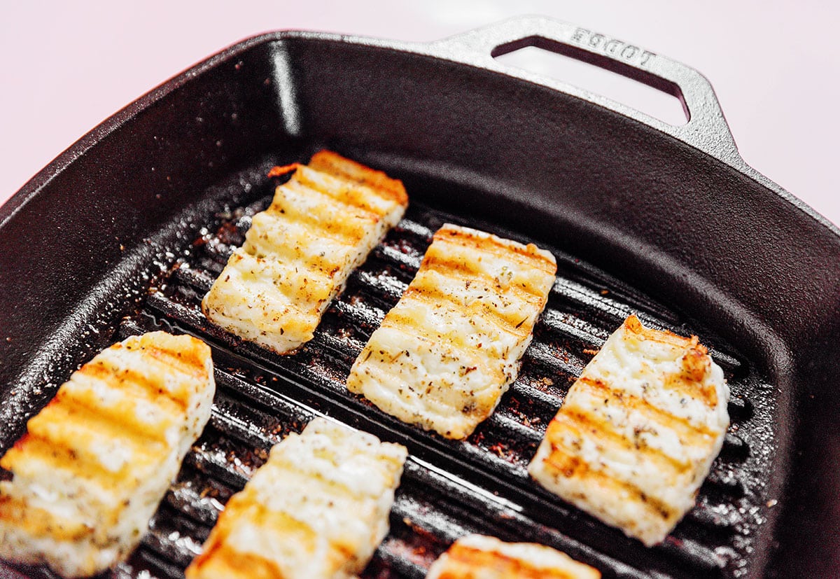 halloumi on the grill with light grill marks.