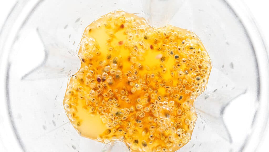 Passion fruit pulp in a blender.