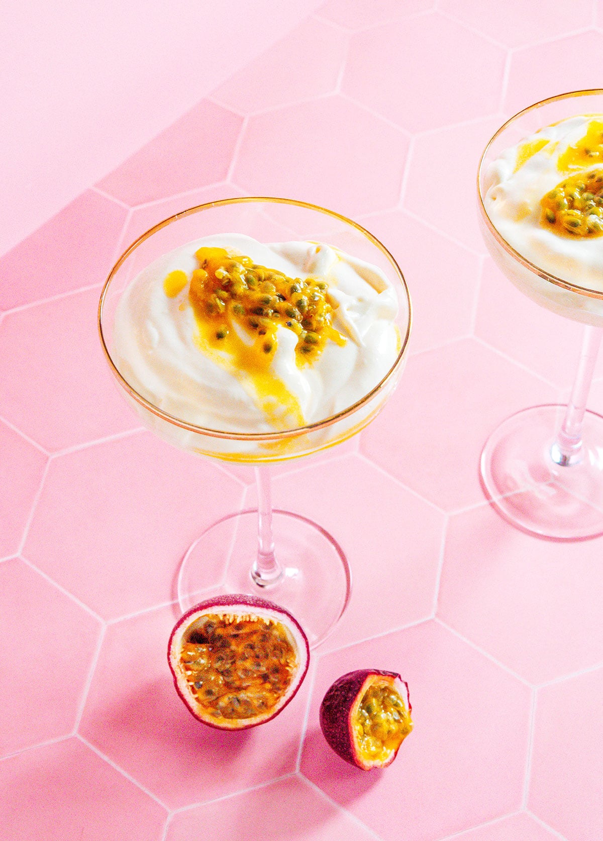 Passion fruit mousse in two martini glasses.