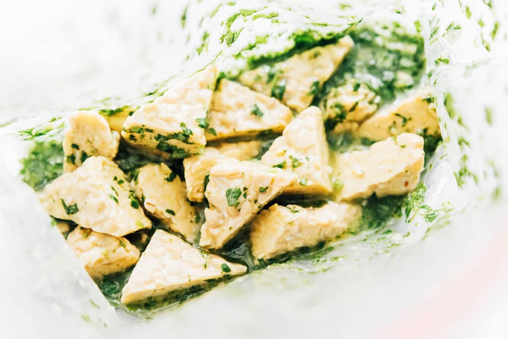 Cilantro lime marinade on tempeh triangles in a ziploc bag.