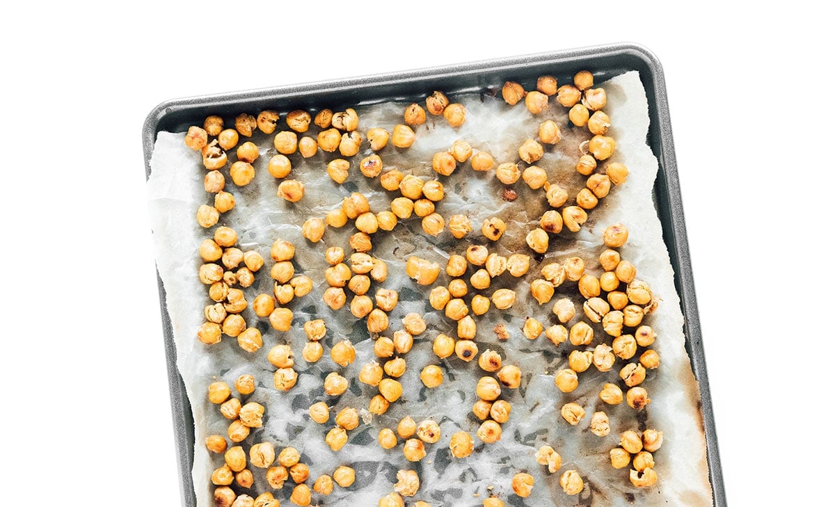 Chickpeas on a baking sheet.