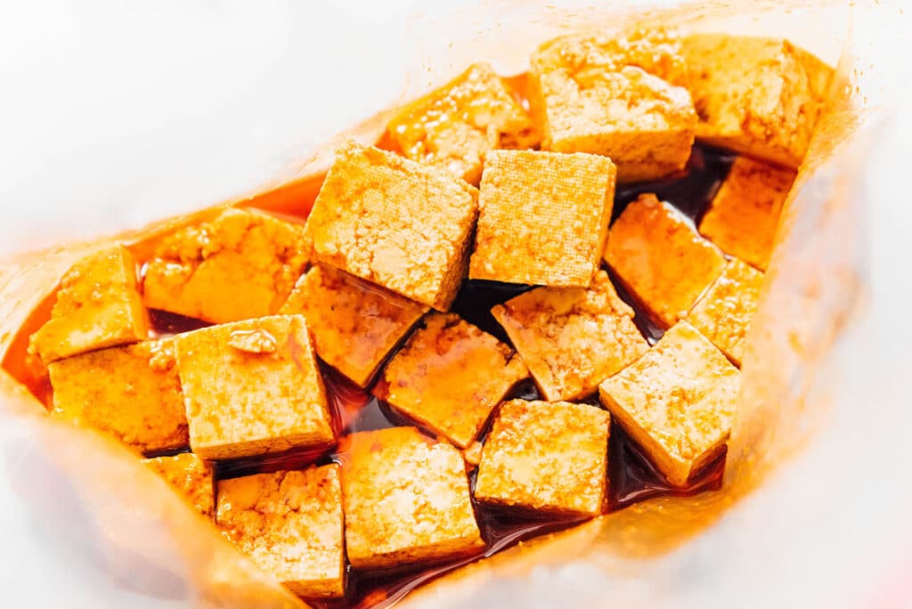 Smoky bacon flavor marinated tofu cubes in a baggie.