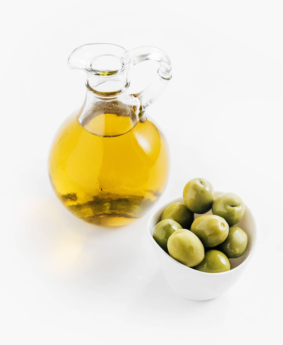 Jar of olives with a jar of olive oil