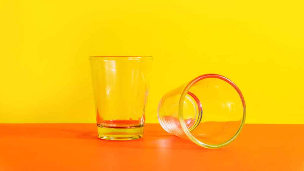 Picture of shot glasses on orange background