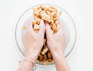 Squeezing water out of soy curls.