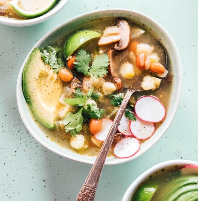 Pozole verde in a bowl with a spoon