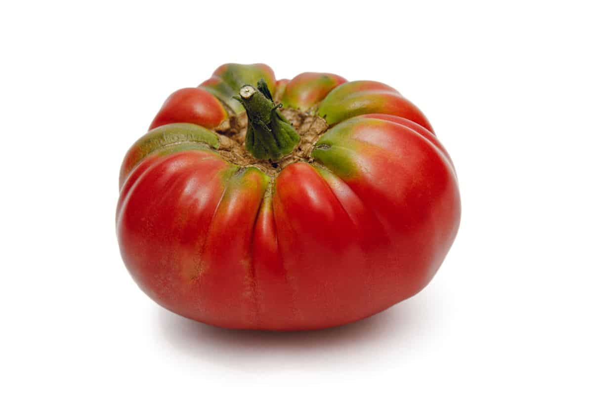 One german johnson tomato on a white background.
