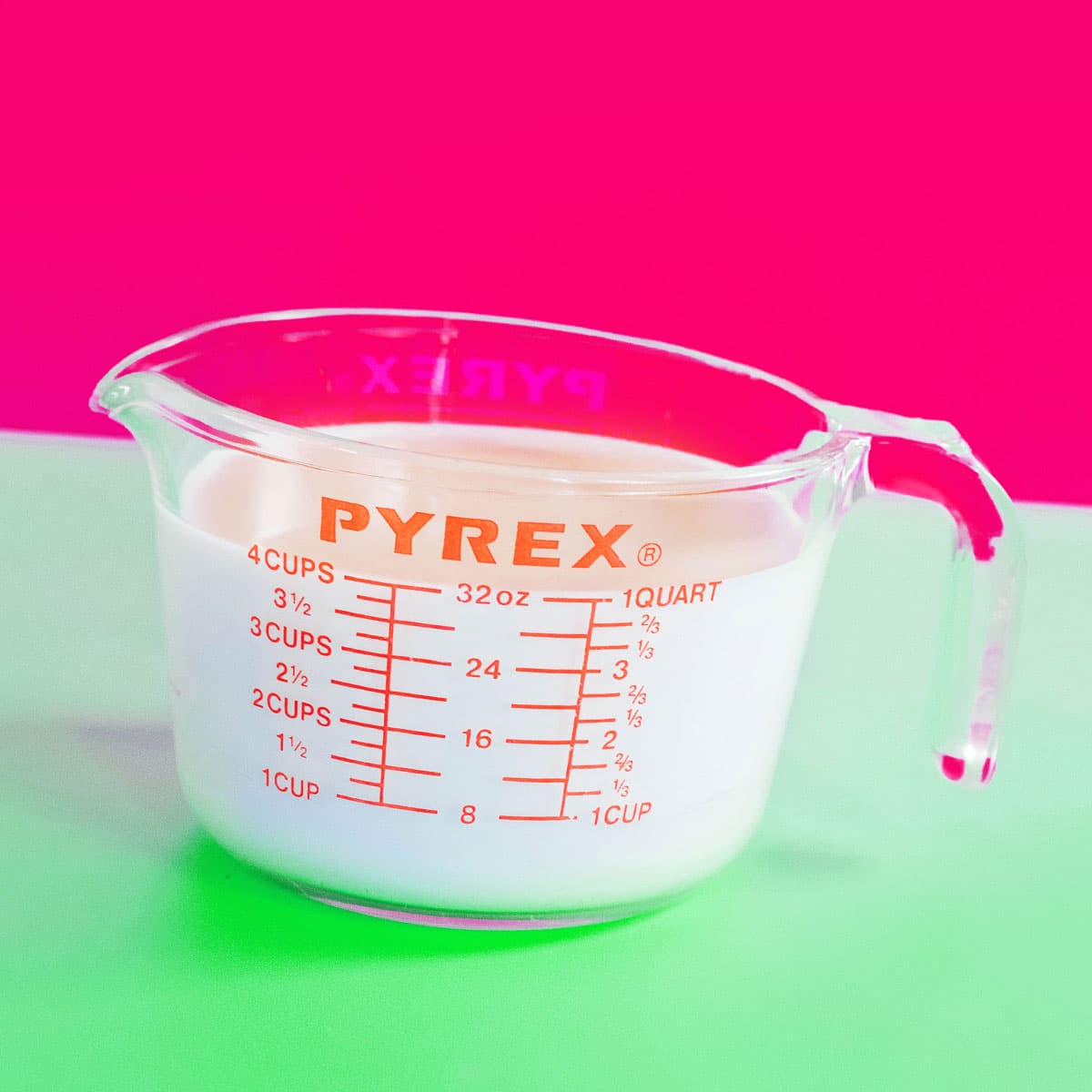 Glass pyrex liter on colorful background.