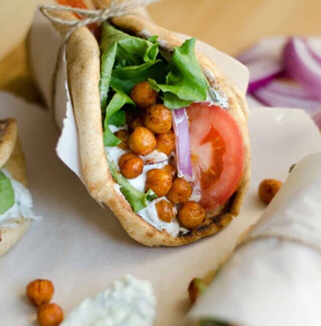 Closeup of a chickpea gyros wrapped in paper.