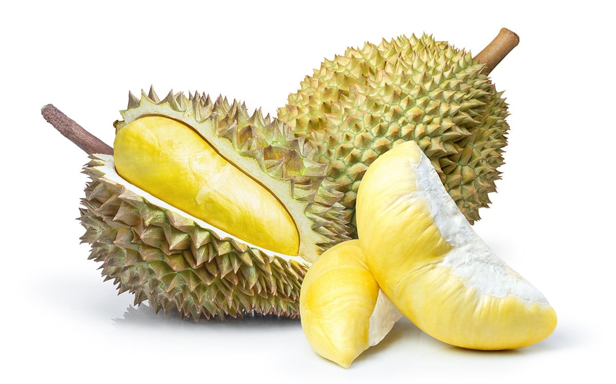 Two durian cut open on white background