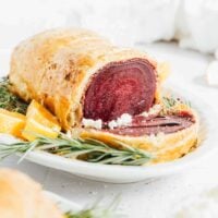 A plate with beet wellington on it.