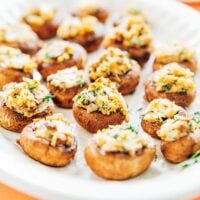 Stuffed mushrooms on a white platter
