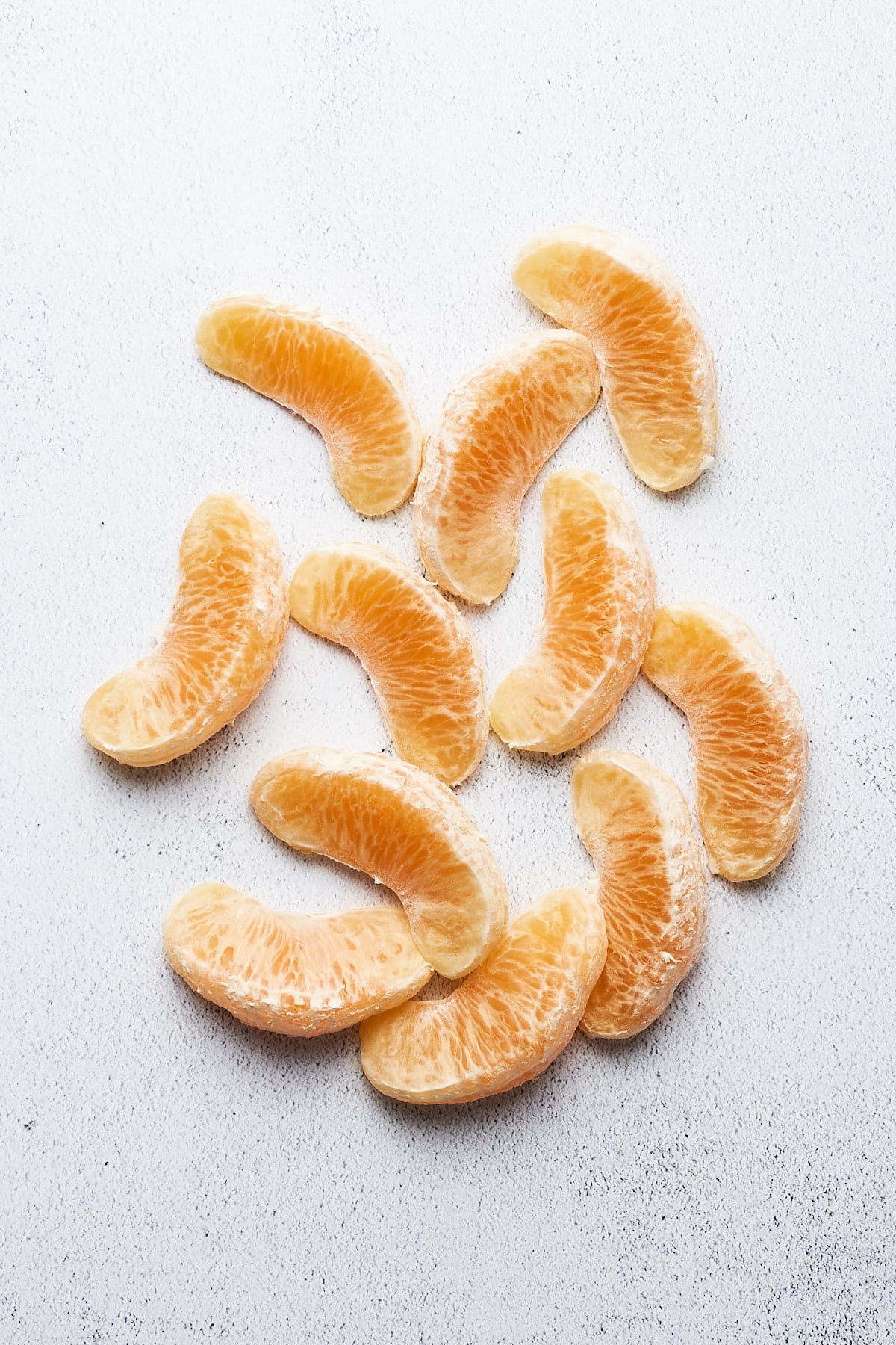 Peeled orange pieces.