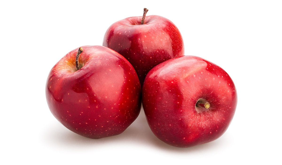Red delicious apples on white background.