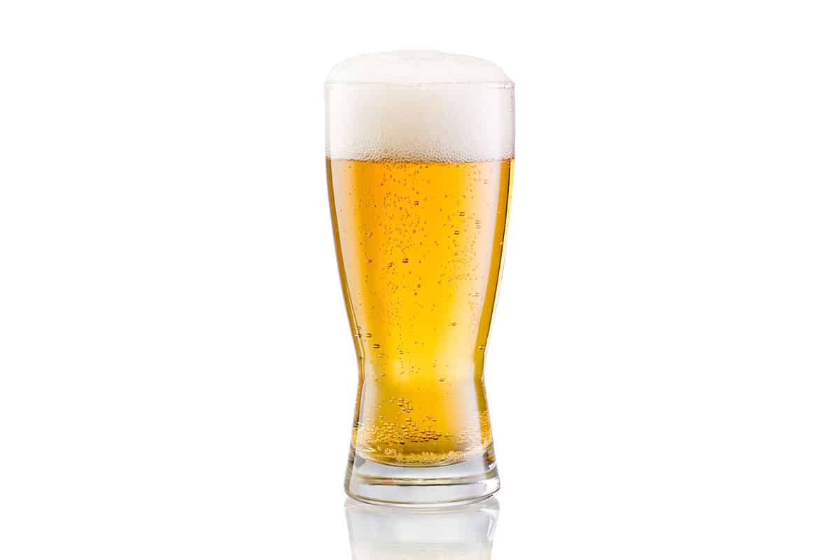 Beer in a glass on a white background.