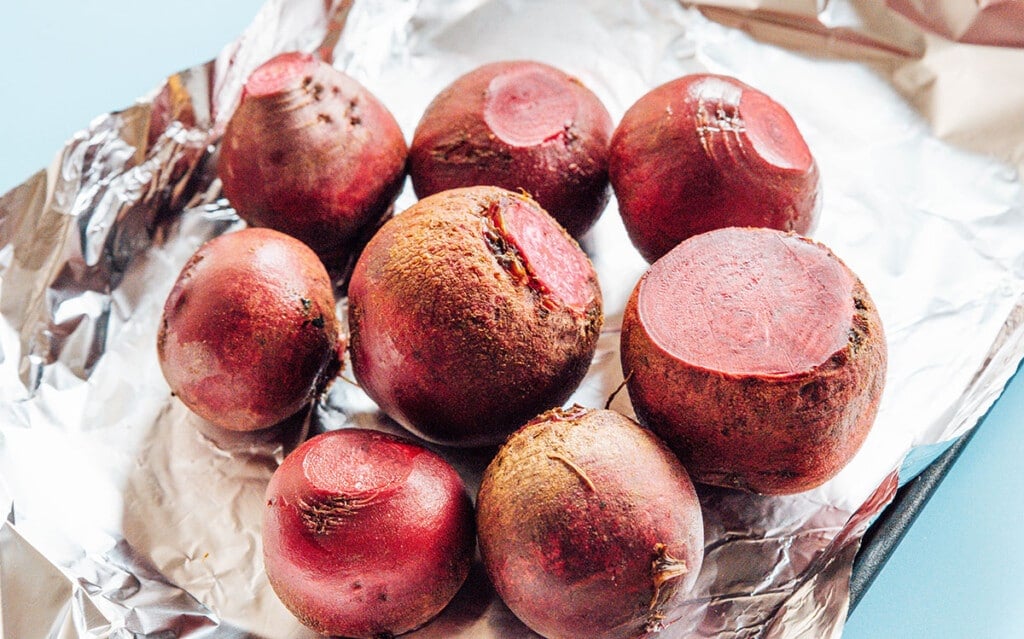 Roast: Preheat oven to 400°F (204°C). Wash the beets, then wrap them all in one big aluminum foil pouch. Roast for about 1 hour, until beets can be easily pierced with a fork.