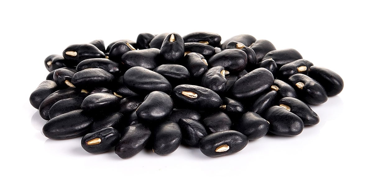Black beans isolated on a white background.