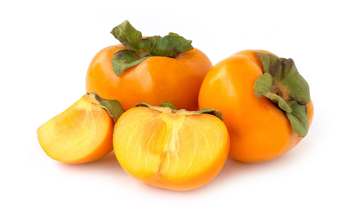 Persimmons on a white background.