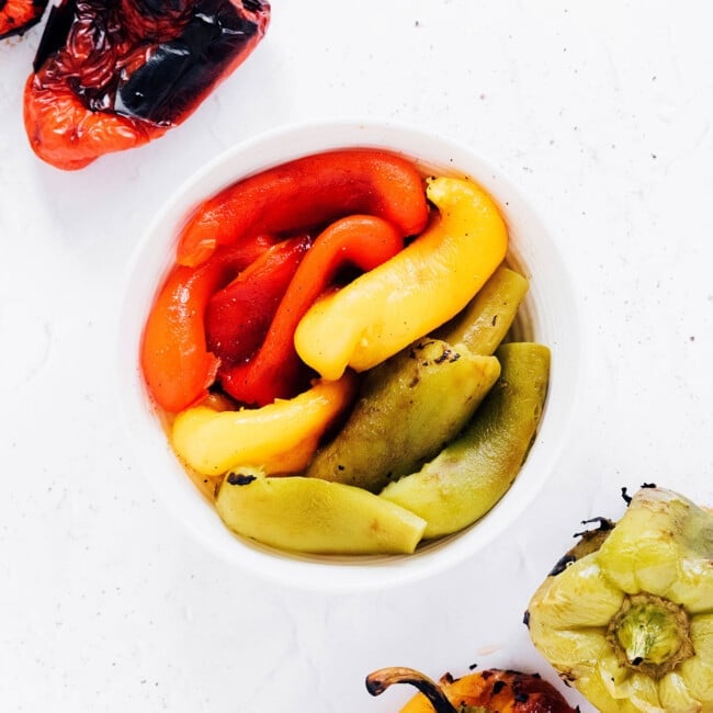Roasted peppers in a white bowl