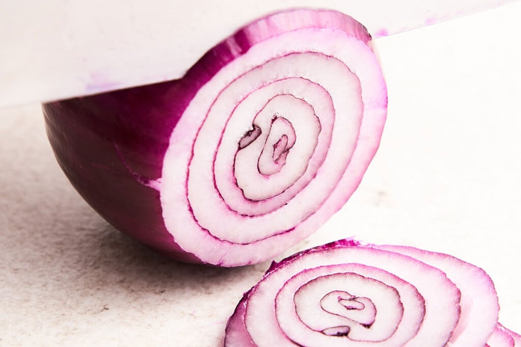 Cutting onion rings.