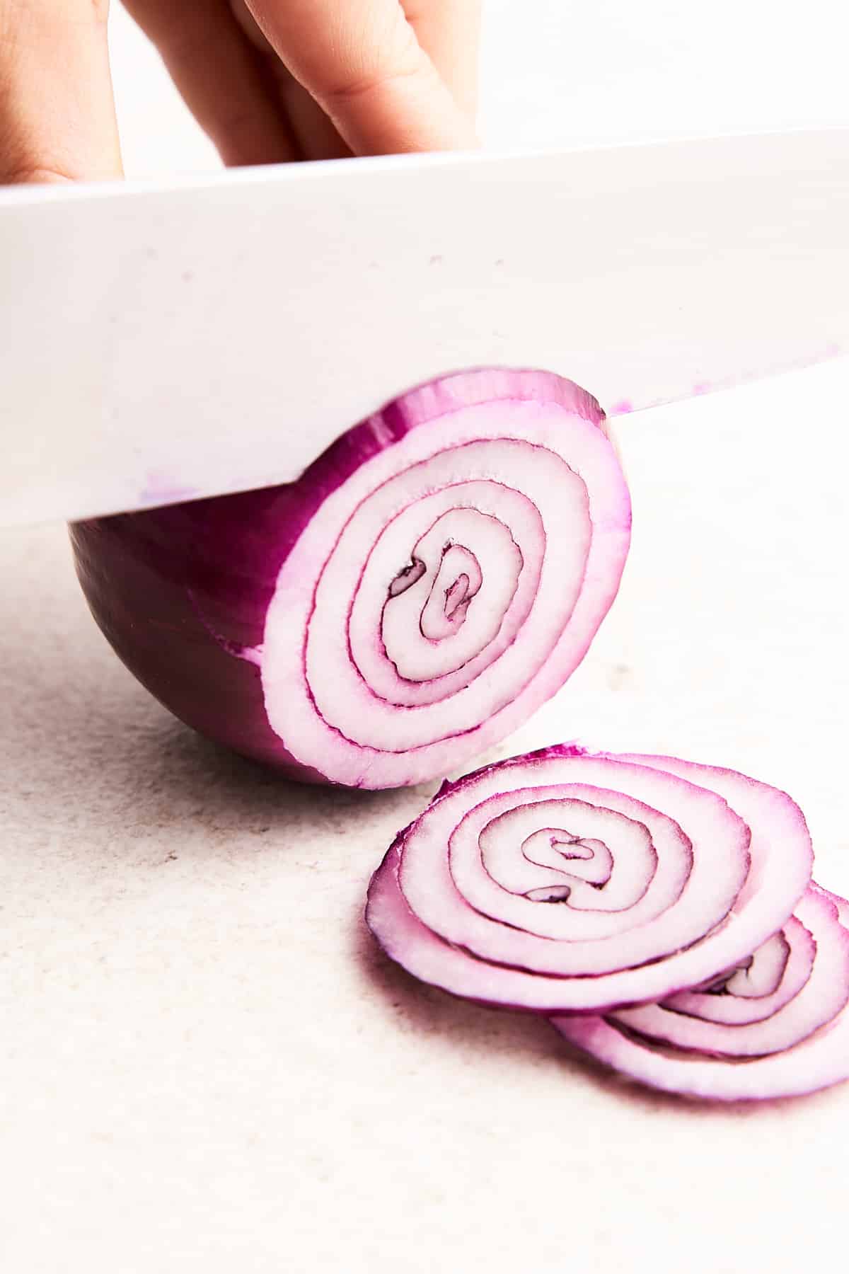 Slicing an onion into rings.