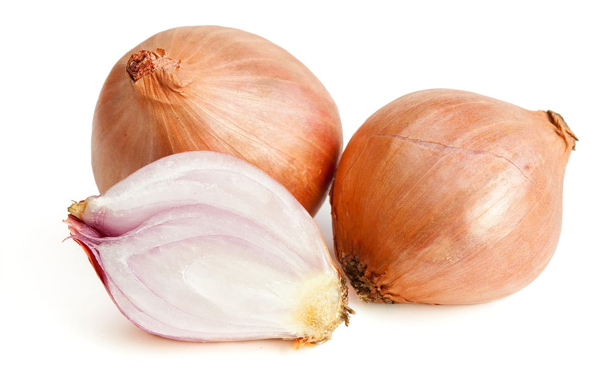 Shallots on a white background.