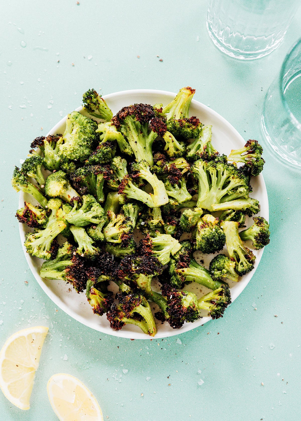Crispy browned broccoli florets in a white serving bowl.