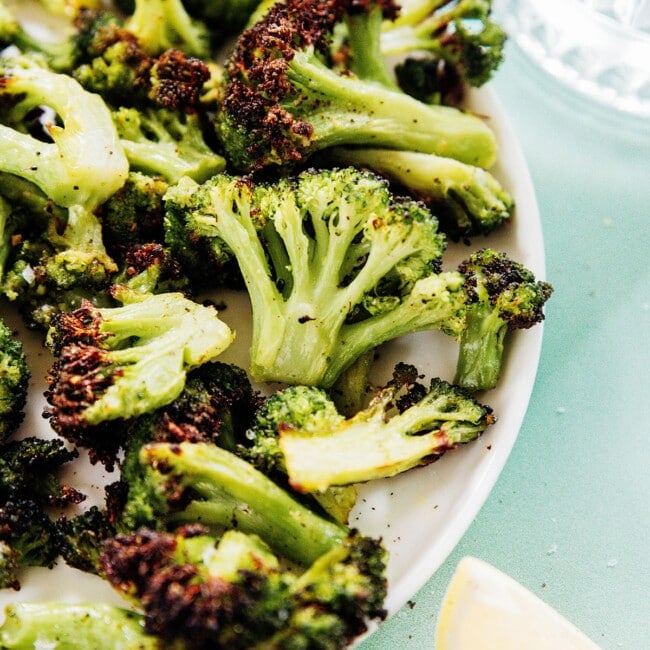 Air fryer frozen broccoli on a plate.