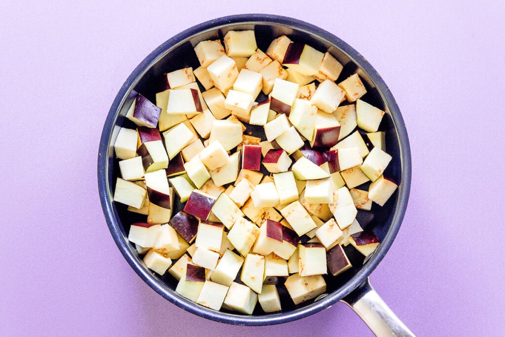 Diced eggplant in a pan.