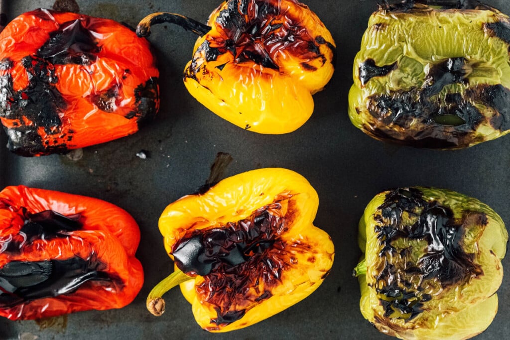 Broil: Place peppers on the upper rack and broil, watching closely. Turn peppers every few minutes until they are charred on all sides (about 10 to 15 minutes).