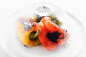 Steam: Immediately transfer peppers to a plate and cover with a bowl (or place them in a bowl and cover with plastic wrap). Let peppers steam for 15 minutes - this will make peeling a breeze!