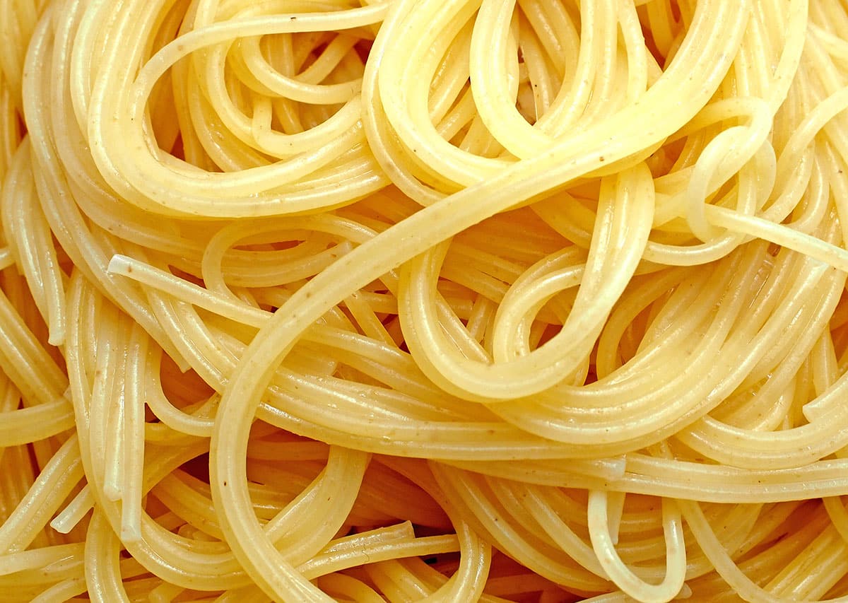Angel hair pasta on a white background. 