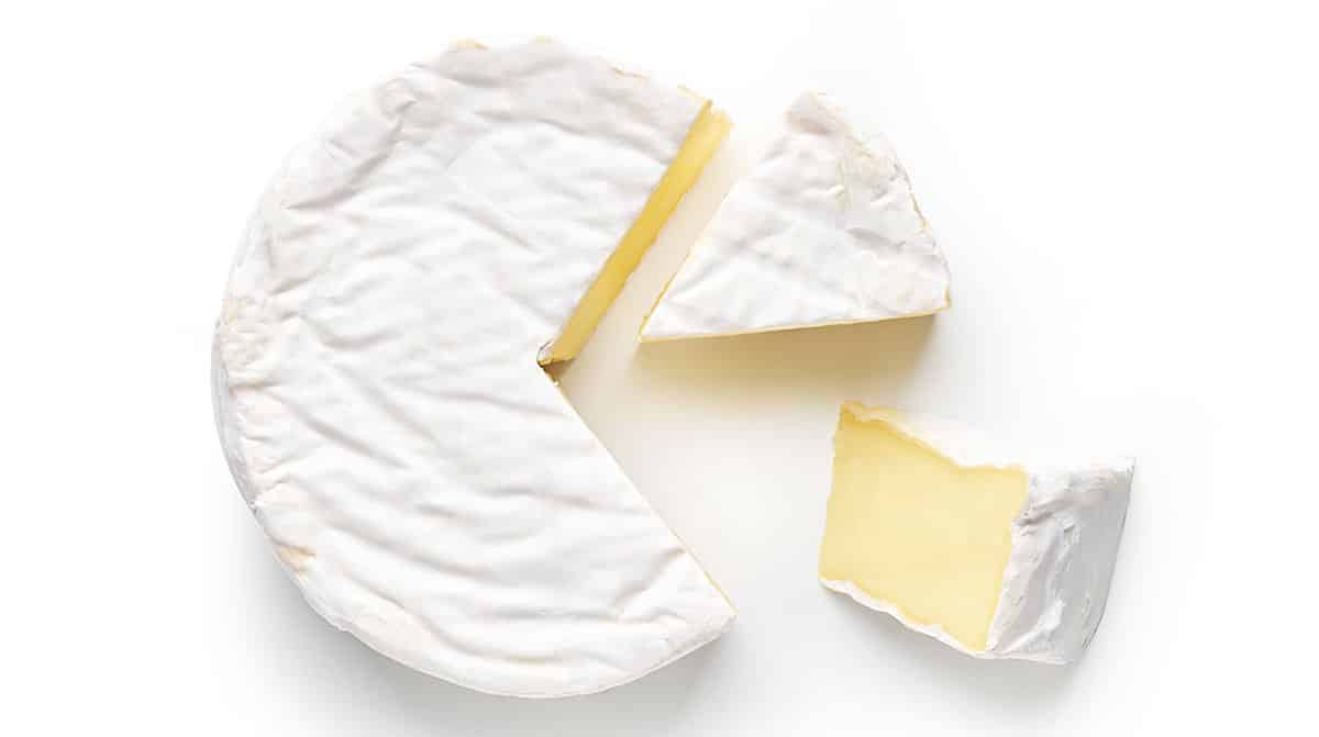 Brie cheese isolated on a white background.