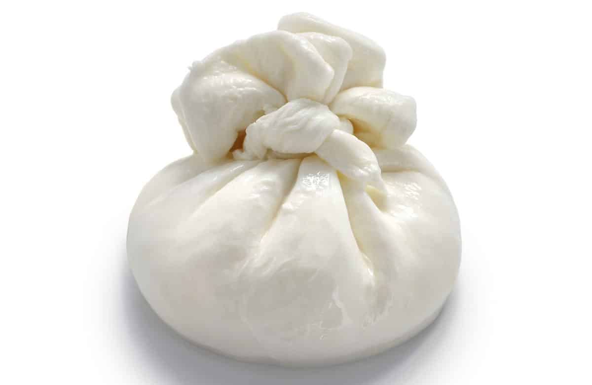 Burrata cheese isolated on a white background.