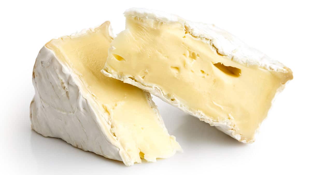 Camambert cheese isolated on a white background.