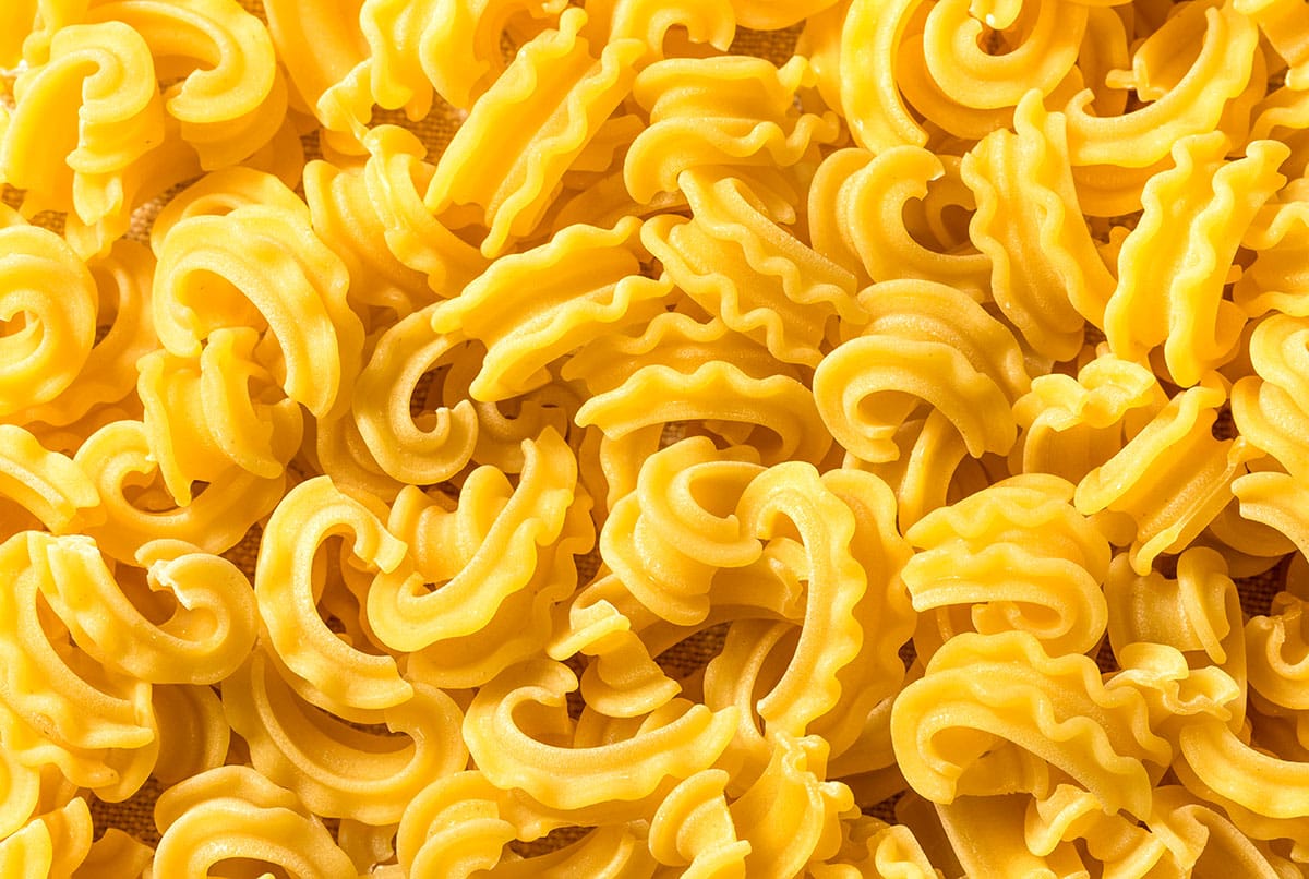 Cascatelli pasta on a white background. 