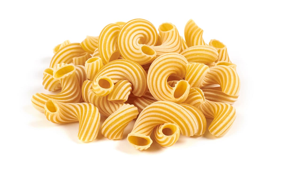 Cavatappi pasta on a white background. 