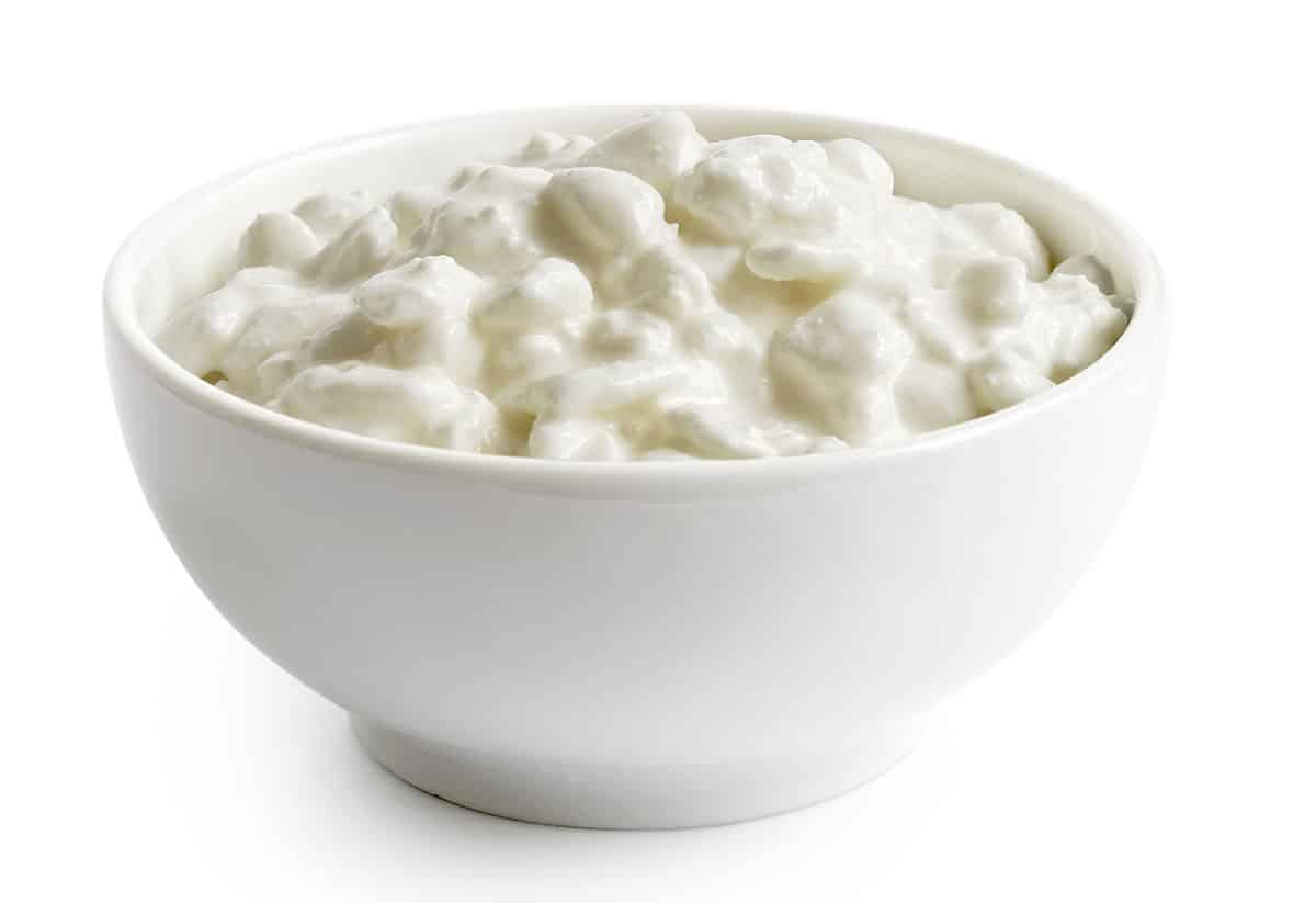 Cottage cheese isolated on a white background.
