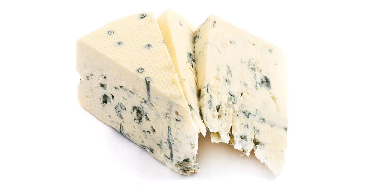 Danish blue cheese isolated on a white background.