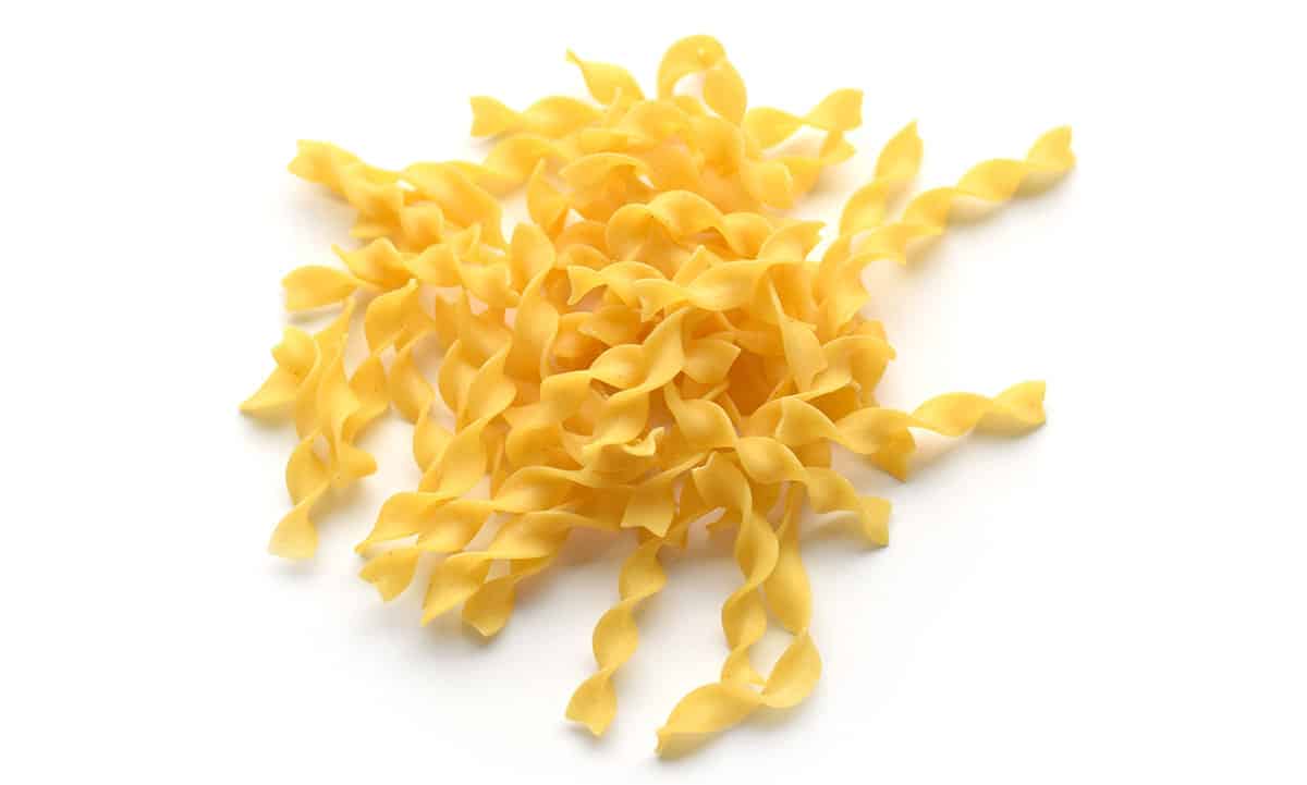 Egg noodles on a white background. 