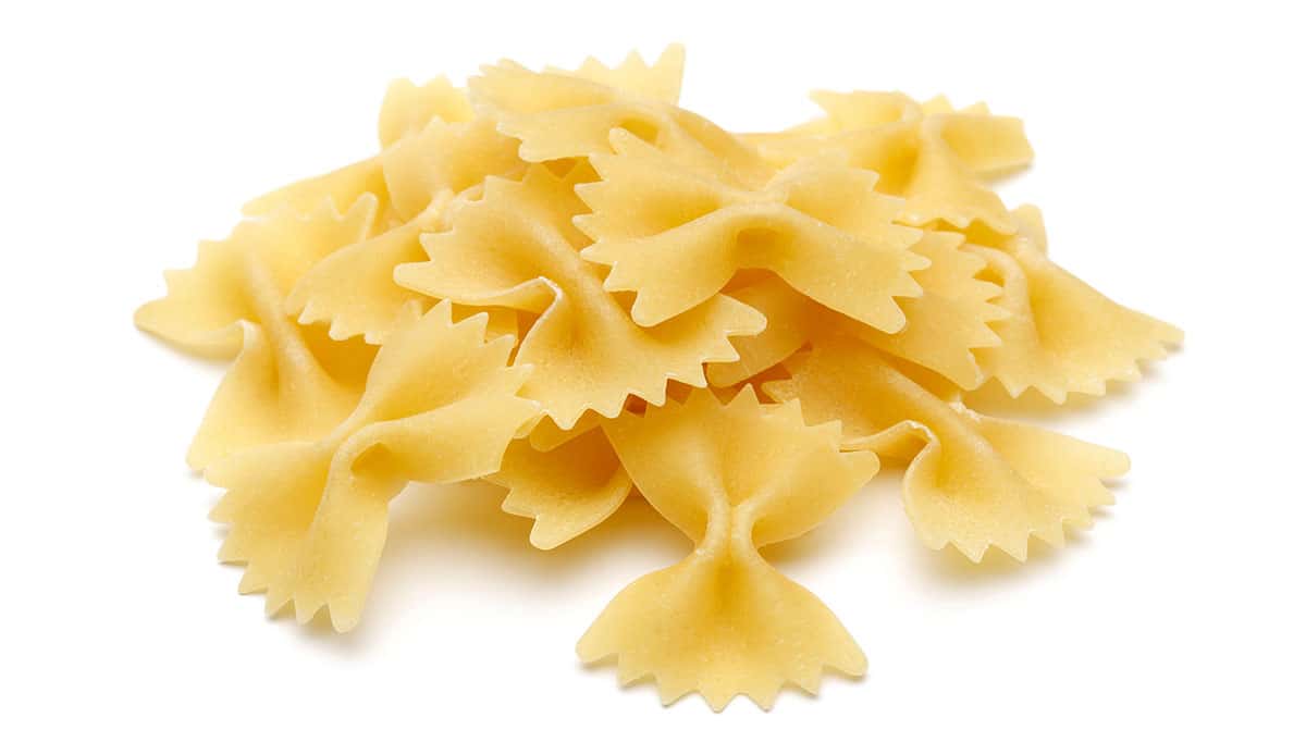 Farfalle pasta on a white background. 