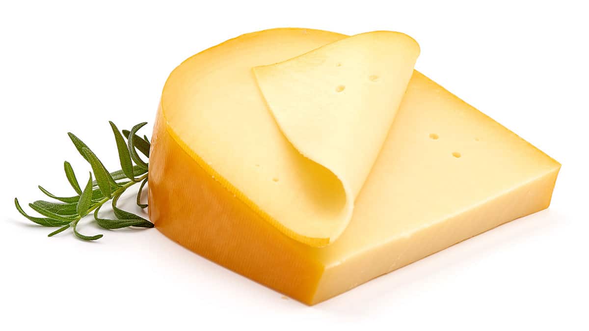 Gouda cheese isolated on a white background.
