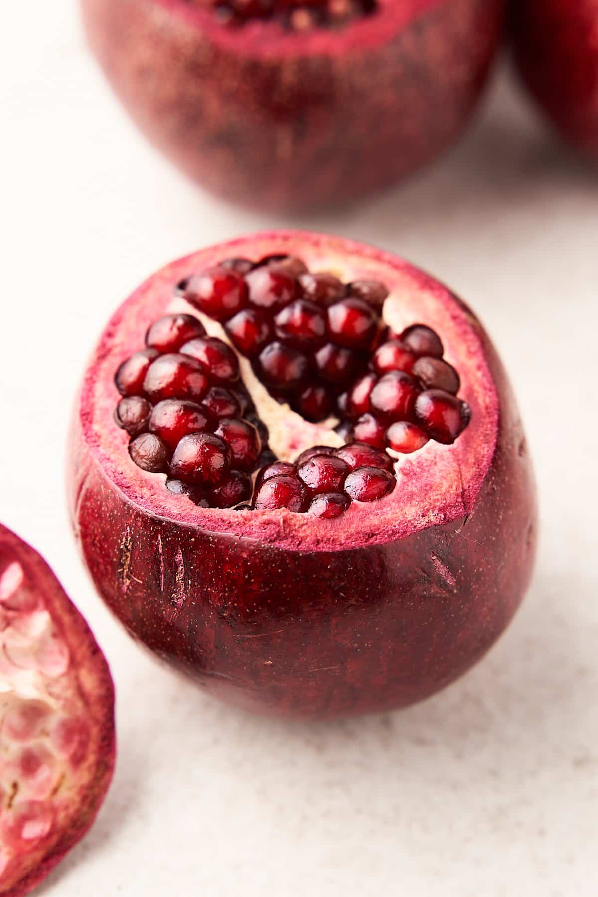 A pomegranate with the top cut off.