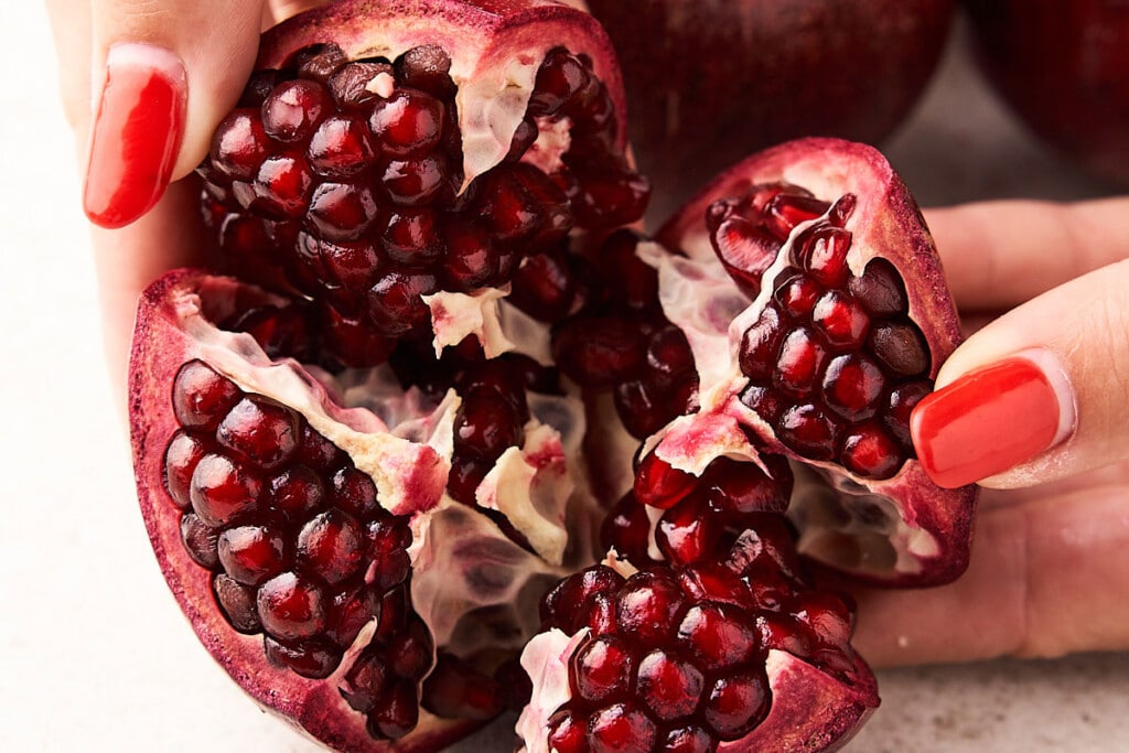 Opening a pomegranate.